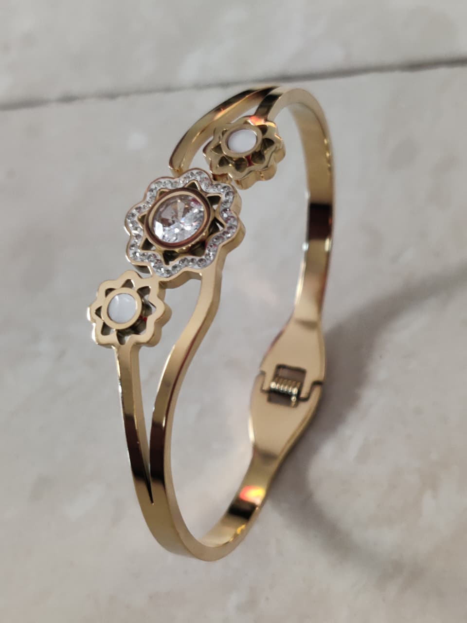 SHIHRI Gold Plated Stainless Steel Bracelet with Triple Flower Design & Crystal Stone”