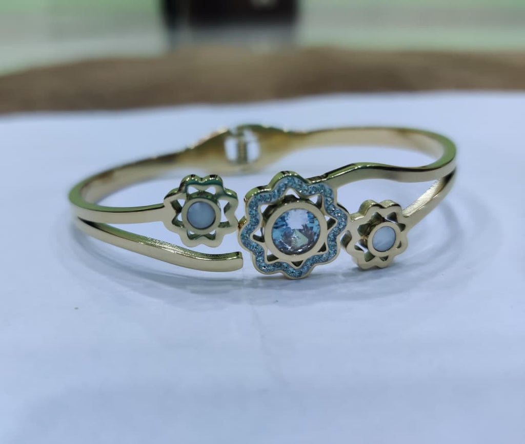 SHIHRI Gold Plated Stainless Steel Bracelet with Triple Flower Design & Crystal Stone”