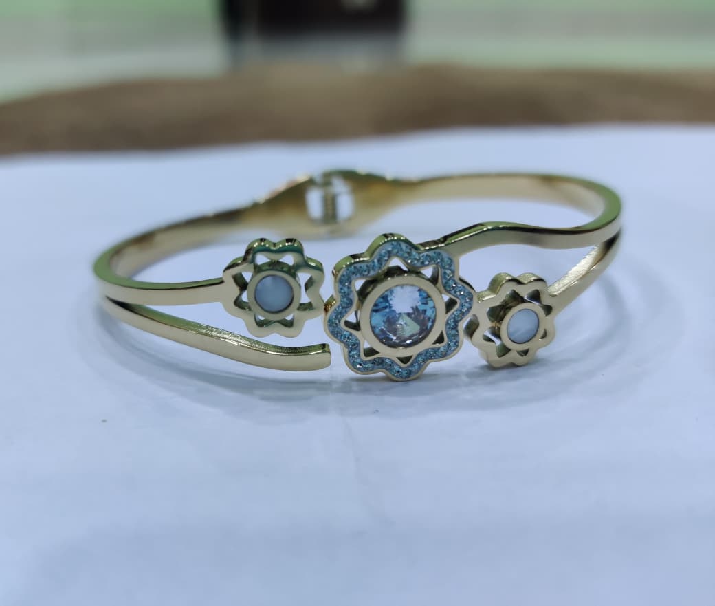 SHIHRI Gold Plated Stainless Steel Bracelet with Triple Flower Design & Crystal Stone”
